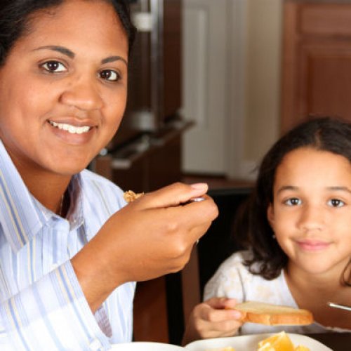 woman and daughter eating