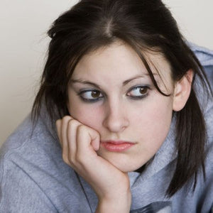 Young woman looking miserable