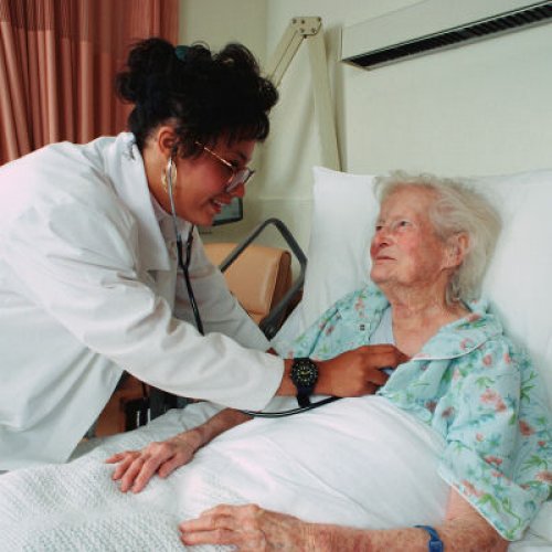 doctor listening to chest of patient